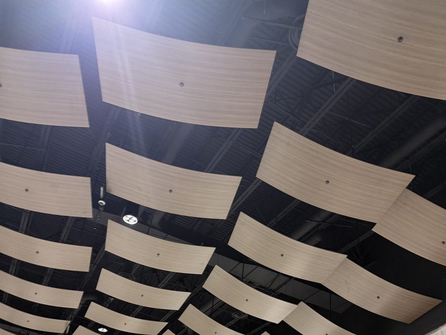 Wave-pattern acoustical panels viewed across the room