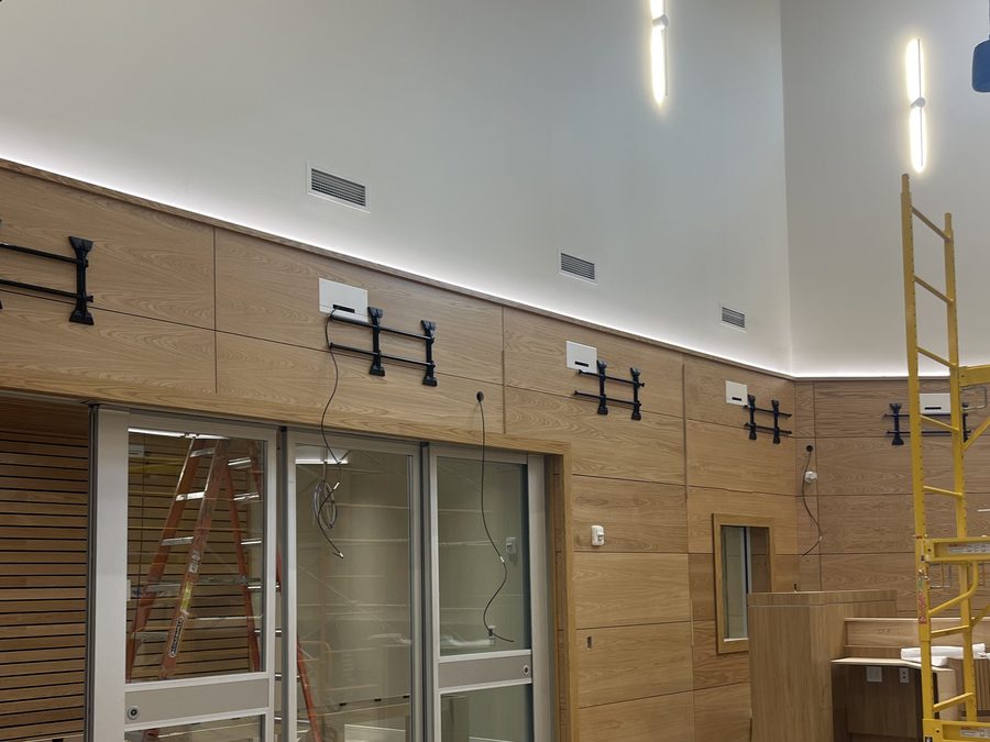 Wood wall paneling with integrated doors and equipment